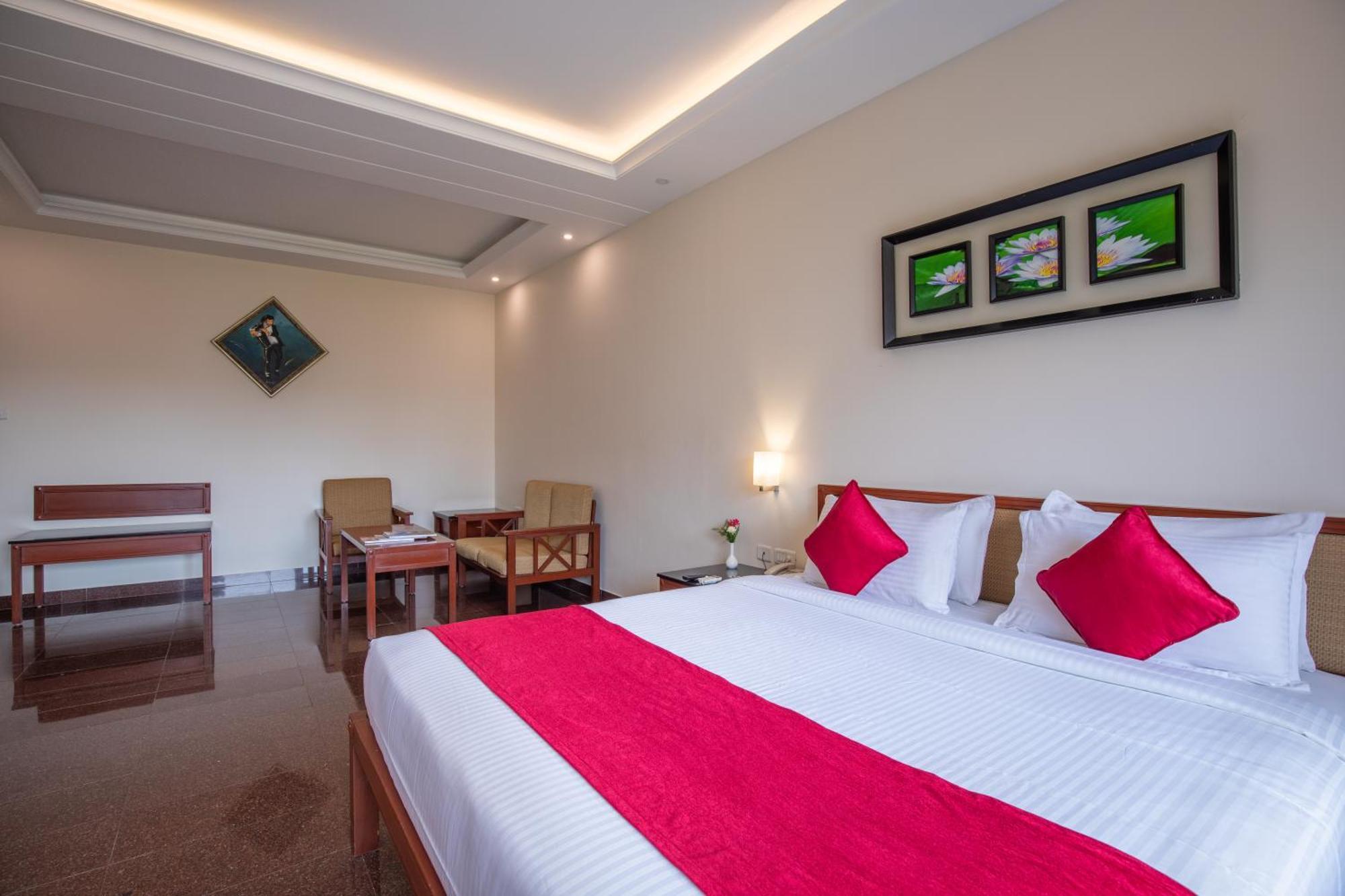Jenneys Residency Hotel Kojambuttúr Szoba fotó
